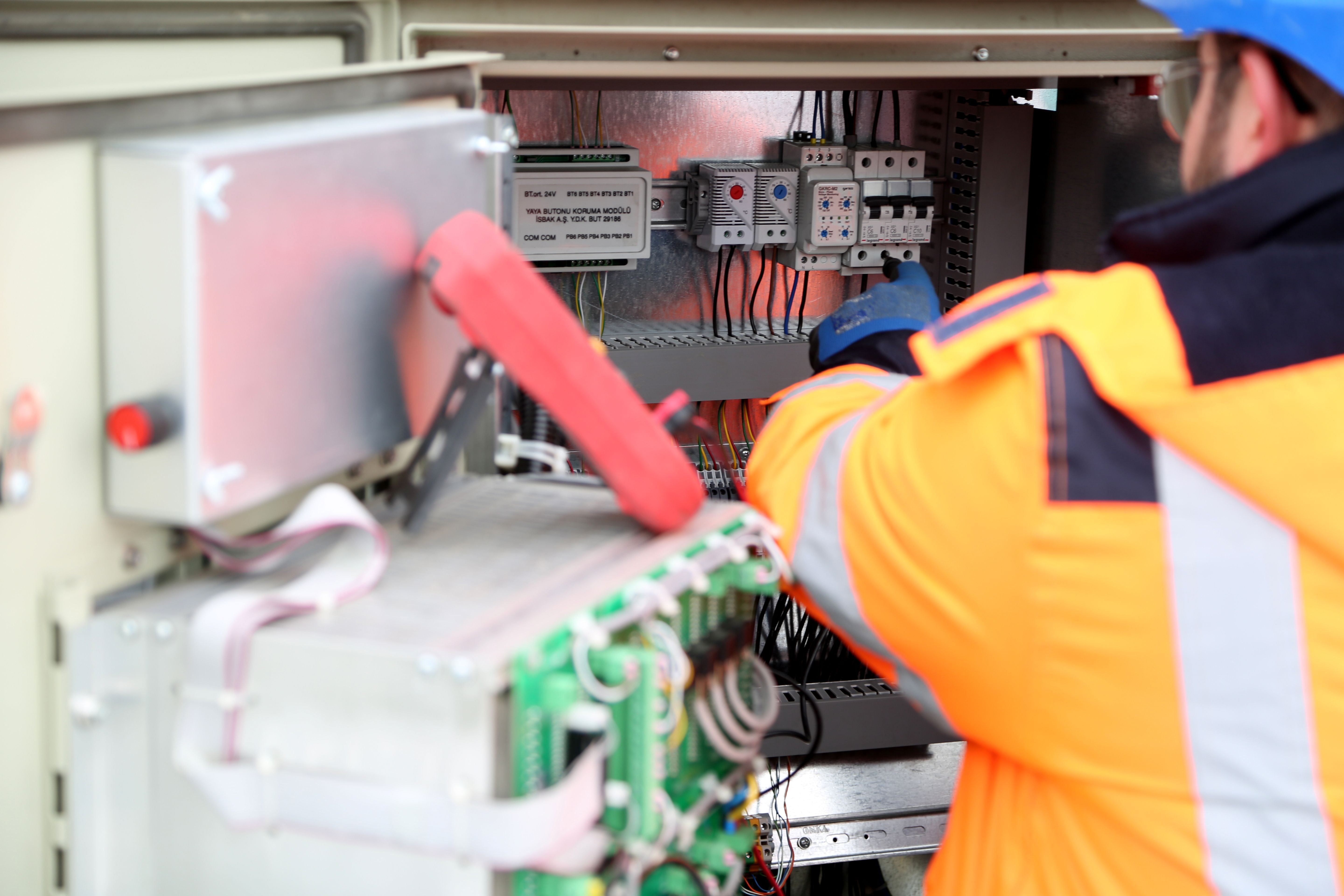 Electrician using diagnostic tools to troubleshoot electrical issues